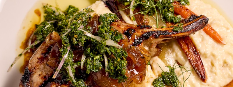 Korobuta Pork Chop and Grits (GF) - Fennel soubise, warmfarro salad, lardons, stone fruit salad