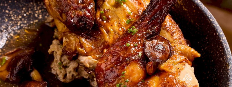 Rotisserie Peach Bourbon Butter Chicken (GF) - Black garlic potato salad, roasted local mushrooms, chicken jus