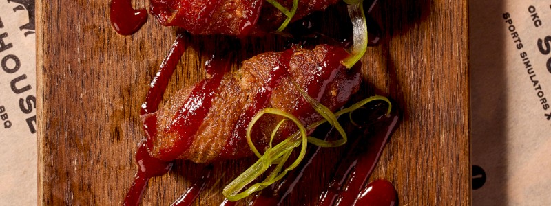 Okie Zingers - Bacon wrapped jalapeños, brisket, BBQ rub spiced cheeses, green chiles, fried potatoes with Wild Not Mild BBQ sauce