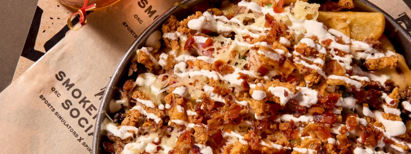 Borracho Muchacho - Loaded steak fries, smothered in Chef B's Chili, brisket, and queso topped with pico di gallo, fried onions, white cheddar, pickled jalapeños, chipotle crema, sour cream, and bacon