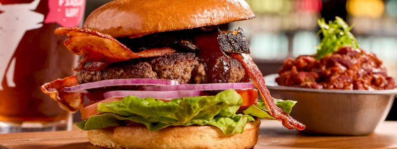 Custom-blended Burger - Flame-grilled 8 oz. Black Angus beef topped with American cheese, lettuce, tomato, onion, and BBQ mayo