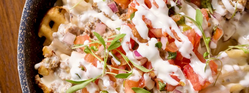 Chido's Loaded Papas - French fries, ground beef, pico de gallo, quest blanca, pepper jack, cilantro, and crema (GF)