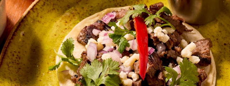 Carne Asada (GF) - Skirt steak, diced onions, cilantro, queso fresco, and salsa verde