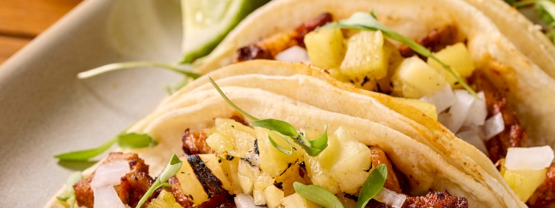 Chipotle Al Pastor (GF) - Achiote pepper braised pork
shoulder, cilantro, diced onion,
and pineapple