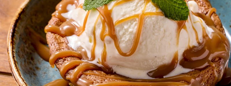 Pan De Elote - Warm Mexican sweet cornbread topped with vanilla ice cream and cajeta caramel sauce