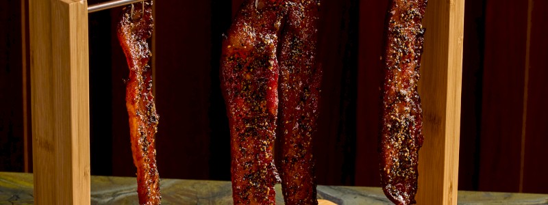 Thick-cut Bacon - Cayenne, brown sugar, maple, and cornbread,
topped with green onions