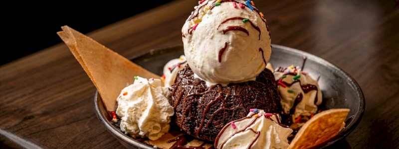 Fudge Lava Cake - Served with vanilla bean ice cream and chocolate sauce