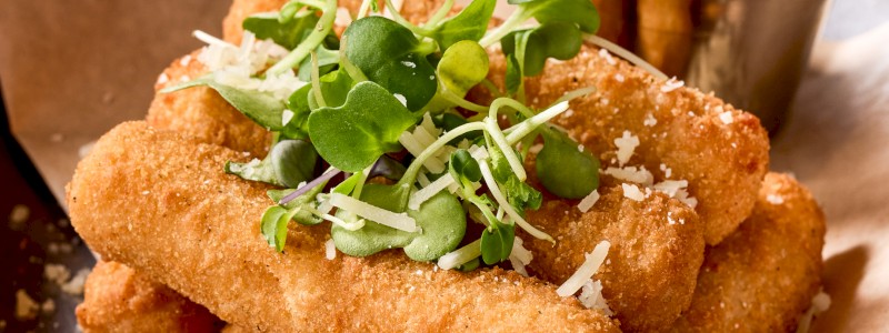 MOZZARELLA STICKS - Fried mozzarella, Really Ranch seasoning, micro basil,
and spicy marinara.