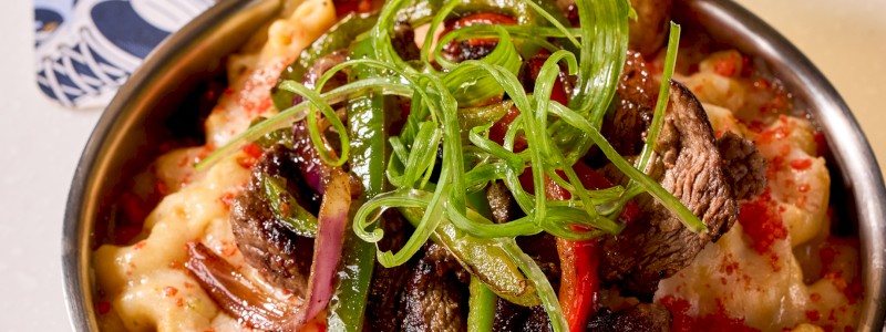 THE HEATER - Pepper jack blend, sliced steak, grilled jalapenos, and crushed Flamin’ Hot Cheetos.