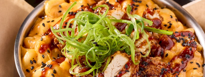 THE CHANGE UP - Gojuchang mac, Korean BBQ chicken strips,
sesame seeds, and green onions.