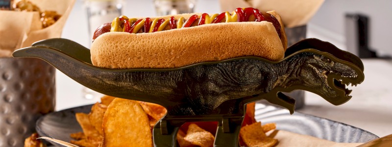 DINOSAUR DOG - Hot dog or corn dog, served with a dinosaur toy.
