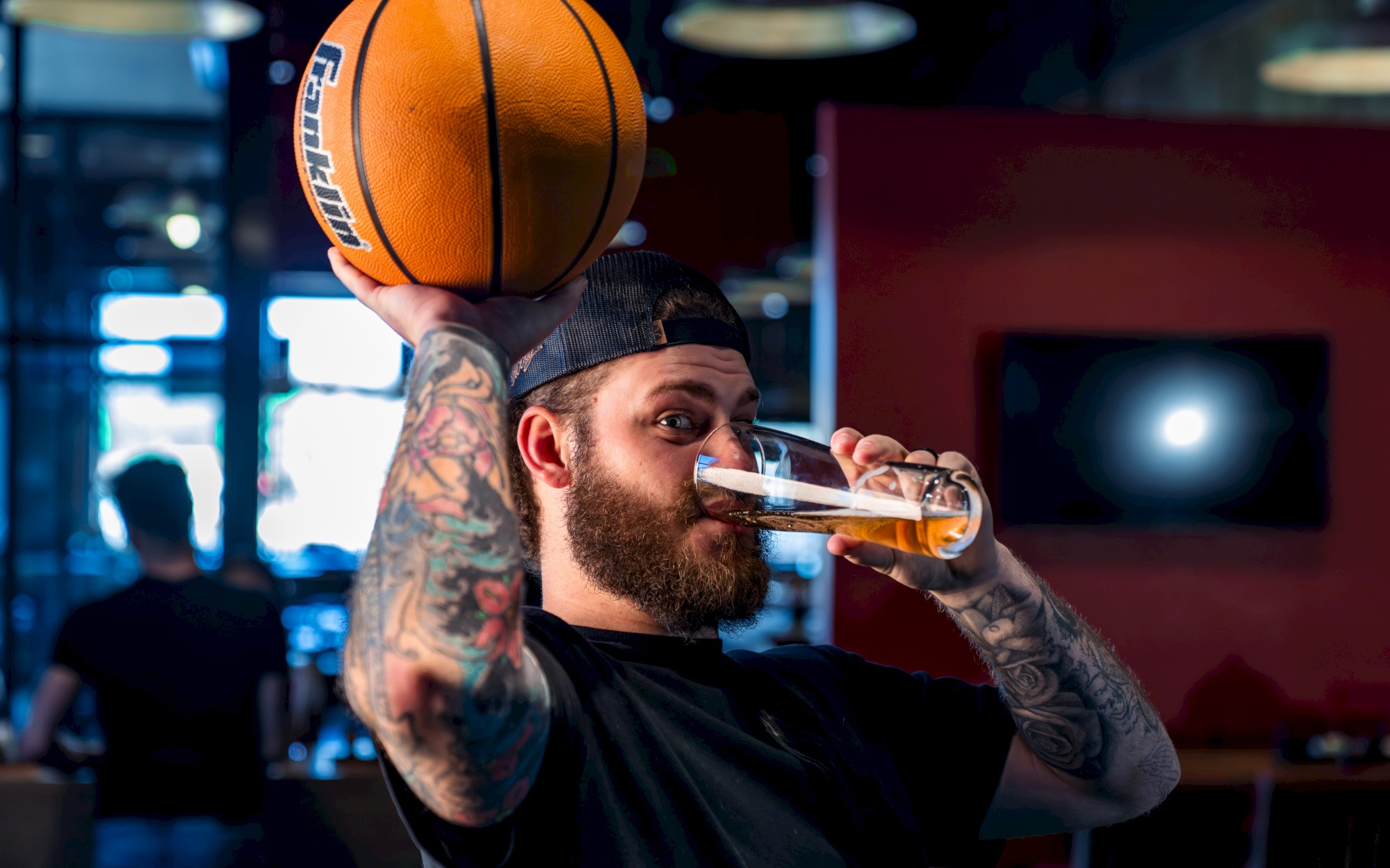 Sports simulator action inside Smokehouse Social at OKANA Resort, where guests can play interactive games while enjoying smoked specialties from the Smokehouse Social menu, known for standout BBQ in OKC.