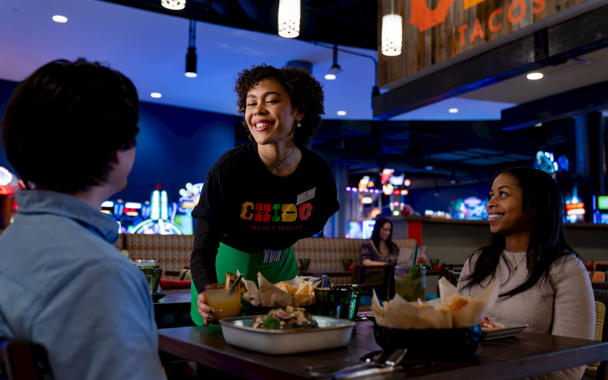 Guests enjoying the Chido Menu at OKANA Resort in OKC, a vibrant Mexican restaurant known for bold flavors and shareable plates.