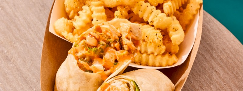 BUFFALO CHICKEN WRAP - Grilled chicken, romaine, buffalo aioli, croutons,
and Parmesan cheese, on a 10”
flour tortilla