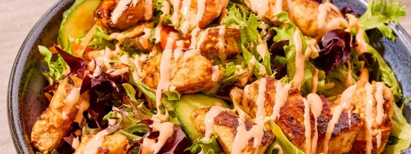 1000 ISLAND SUMMER SALAD W/ GRILLED CHICKEN - Mixed greens, heirloom cherry tomatoes, sliced cucumbers, and shredded carrots