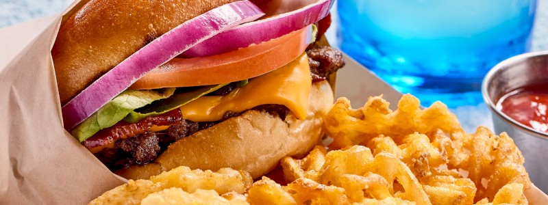 CLASSIC - Single patty, American cheese, lettuce, tomato, onion, and house pickles, served with waffle fries